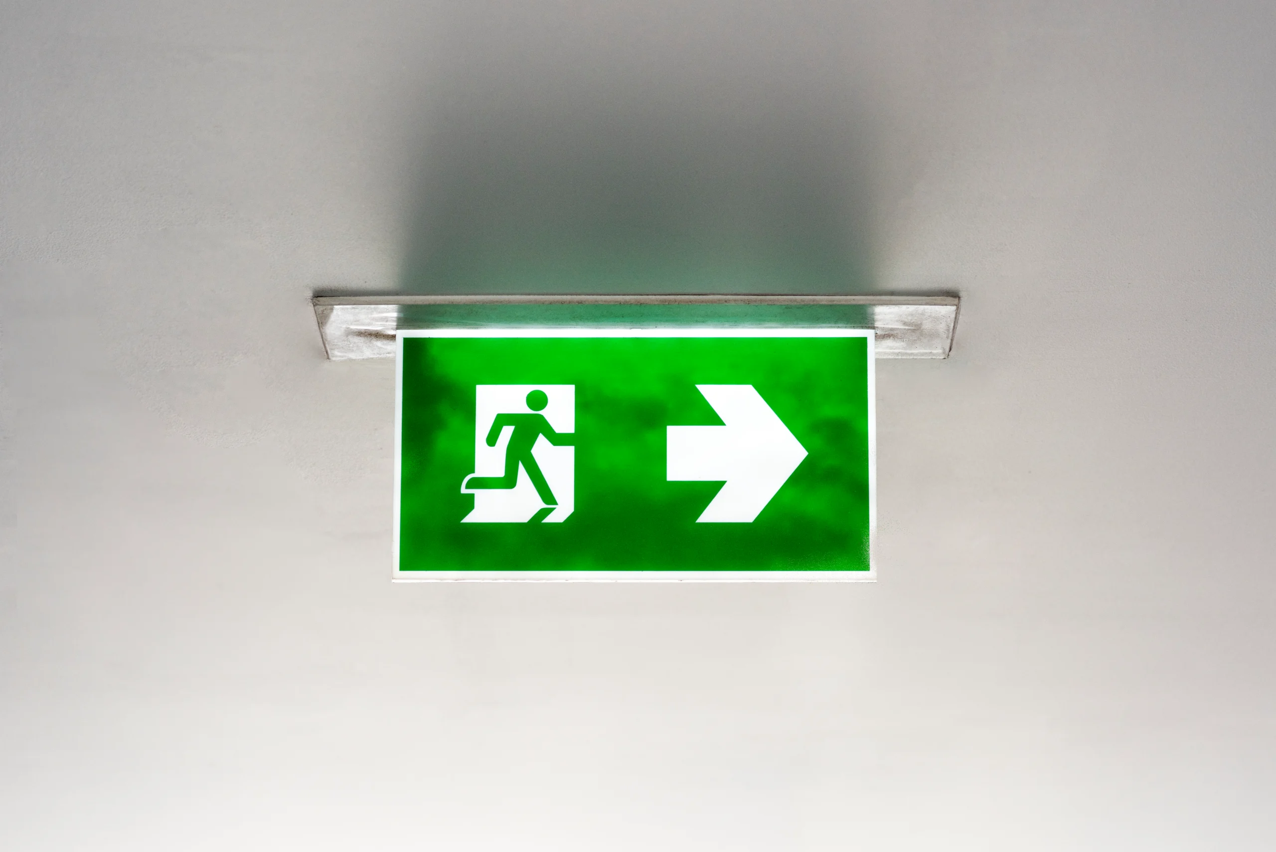 green-emergency-exit-sign-ceiling